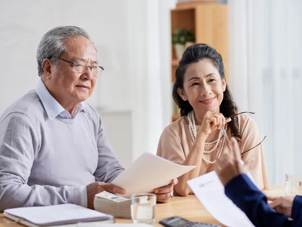 home owners reviewing roofing contract GOOD ROOF WORX